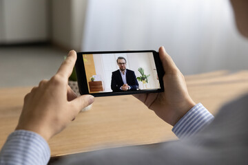 Sticker - Close up of woman employee talk speak on video call on cellphone with male boss or CEO. Business partners have webcam digital online meeting using smartphone, engaged in virtual web event on cell.