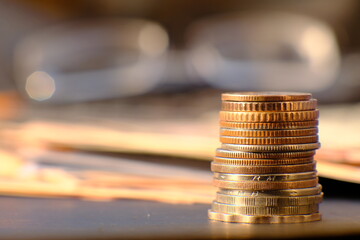 Canvas Print - Stack of coin on table background and business or finance saving money