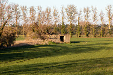 war time pillar box isolated on field, world war 2 anti-tank bunker/ pillbox. These were used for the defence of the UK.