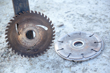 the pair of silver black color old mettle iron cutter blade on the grey background.