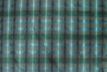 Factory Fabric With A Green Check Pattern. Abstract Background. Horizontal Orientation