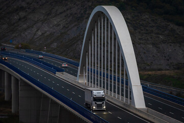 Wall Mural - Truck driving on a viaduct at nightfall