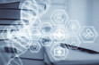 © peshkova - Double exposure of DNA drawing and desktop with coffee and items on table background. Concept of medical science education