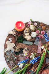 Sticker - wiccan Altar for spring Ostara sabbath. wheel of the year with rabbits, candle, gemstones crystals, flowers and eggs. Esoteric Ritual for Ostara, pagan holiday. Magical Spring equinox