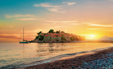 Wall Mural - Island in sea at sunset