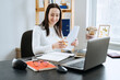 © irissca - Small business, Self-employment, micro-entrepreneurs, accountant, ownership concept. Young businesswoman working with laptop and document from office at home