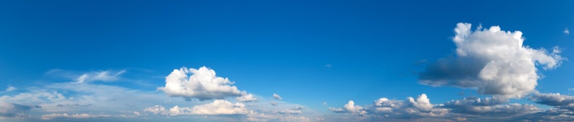 Panoramic fluffy cloud in the blue sky. Sky with cloud on a sunny day.