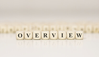 Poster - Word OVERVIEW made with wood building blocks