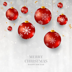 Wall Mural - Christmas background with red Christmas baubles. Elegant light Christmas background with red evening balls