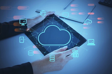 Poster - Businesswoman in formal wear holding tablet in hands, double exposure of cloud service, internet connection icons. Concept of data storage and protection of information