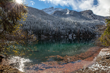 Wall Mural - lake in mountains between autumn and winter