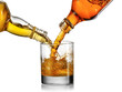 © Mariyana M - Two type of whiskey pour in a glass, blending conception