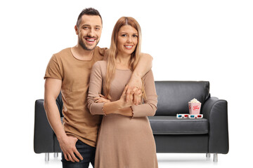 Sticker - Young couple in front of a couch with a box of popcorn and ed glasses