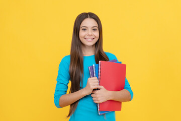 cheerful child girl hold notepad for homework, homework