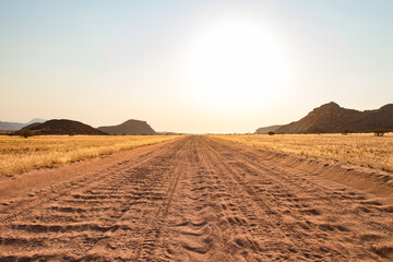 Road trip in Damaraland, Namibia - close up of a washboard gravel sand road in Namibia