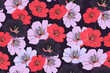 Vector floral seamless pattern. Pink, red, dark purple flowers isolated on a dark purple background. 
