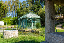 Traditional Old Greenhouse Structure In The Elegant Large Botanical Gardens On A Large Mansion Estate Near Esposende, Portugal. Cute Small Greenhouse In A Private Garden And Pond.