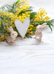 Wall Mural - Rabbits toy, heart and Mimosa flowers. festive spring season. Hello Spring. 8 march, Easter holiday concept