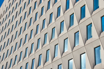 The Hague, The Netherlands, February 13, 2021: the facade of the apartments and municipal offices at Layweg, with trapezoid prefab concrete elements