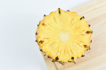 Fresh pineapple slices over white background. Tropical fruit