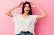 © Asier - Young caucasian woman isolated on pink background celebrating a victory or success, he is surprised and shocked.