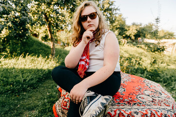 Young chubby girl posing in the countryside