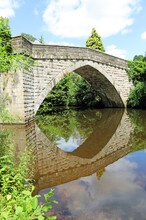 Froggatt Bridge Reflected In The River Derwent, Derbyshire
