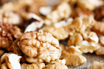 Poster - peeled walnuts lie in a heap in the bright sun