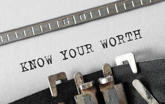 Text KNOW YOUR WORTH typed on retro typewriter