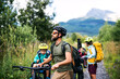 © Halfpoint - Family with small children with bicycles outdoors in summer nature, High Tatras in Slovakia.