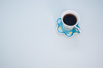 Cup of coffee isolated on blue background