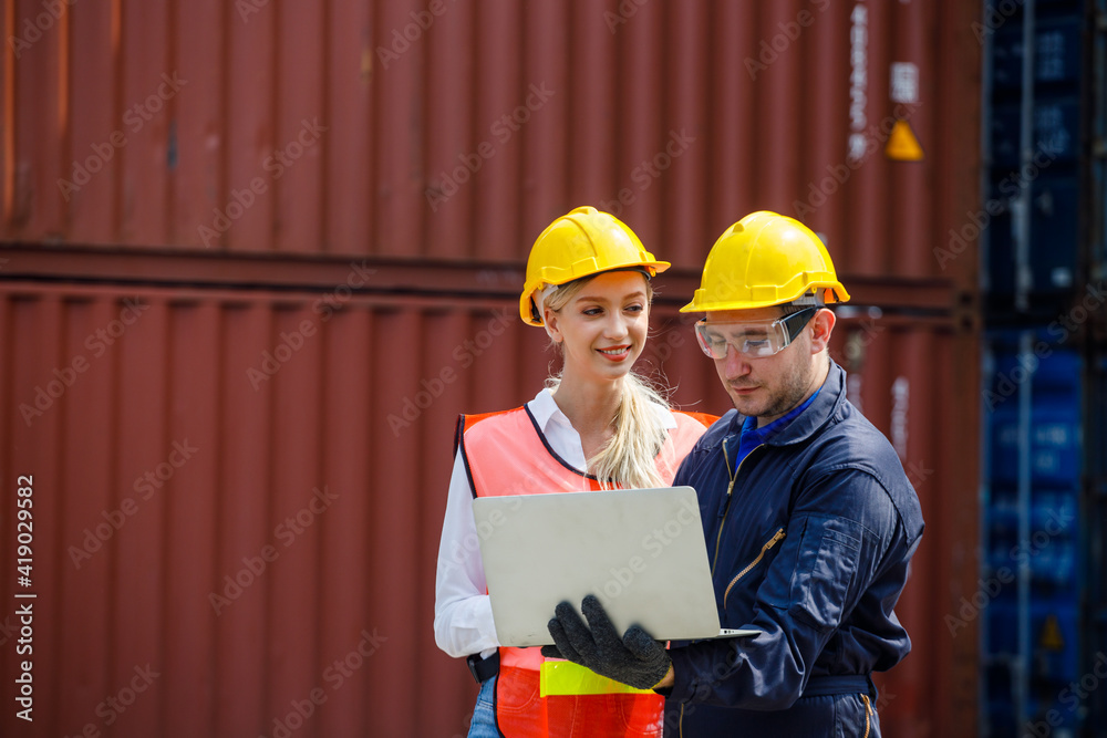 Filing Foreman Foreman is using the laptop to check the layout and planning the ...
