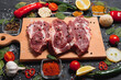 Raw pork chop steak prepare in kitchen with vegetable and spices for food and cooking concept.