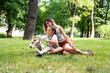 © iordani - young pretty caucasian mother walking with little cute daughter and dog fox terrier, lifestyle people concept