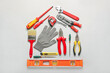 © Pixel-Shot - Composition with construction tools on light background