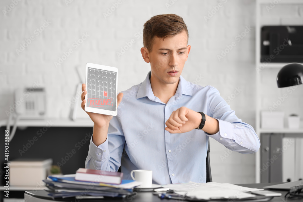 Businessman trying to meet deadline in office