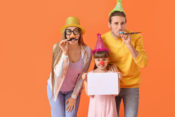 Poster - Young family in funny disguise and with empty paper sheet on color background. April Fools Day celebration