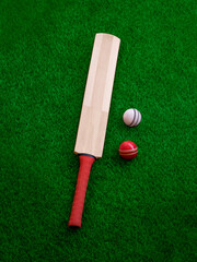 Wall Mural - cricket bat and ball place on cricket ground green grass