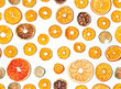 Dried citrus fruits seamless pattern on white background. Dehydrated citrus wheels. Fruit chips - delicious and healthy snack.