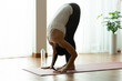 © sopradit - Asian woman pilates exercise yoga in home.