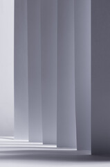 Poster - Abstract white grey background with contrast perspective of stripes, light and shadow as pattern, vertical.