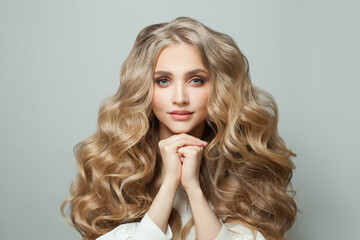 Wall Mural - stylish blonde woman with healthy hair on white background
