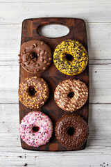 Sticker - donuts on a wooden background