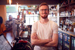 © Monkey Business - Portrait Of Smiling Male Bar Owner Standing Behind Counter