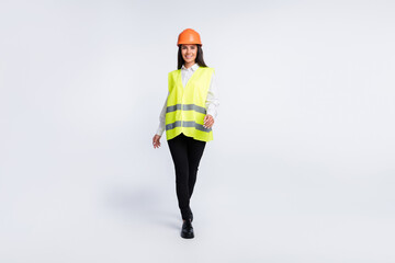 Sticker - Photo of successful worker lady walk wear helmet shirt vest trousers shoes isolated white color background