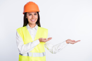 Poster - Photo of promoter lady hands hold empty space wear helmet shirt vest isolated white color background