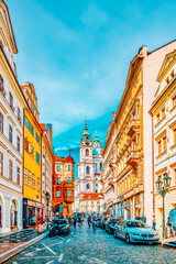 Wall Mural - PRAGUE, CZECH REPUBLIC-SEPTEMBER 5, 2015: Malostranske namesti-main square of Prague's Mala Strana(Lesser Town of Prague) and Church of Saint Nicholas is a Baroque church in the Lesser Town of Prague