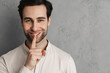 © Drobot Dean - Happy young man asking for silence gesturing with his finger