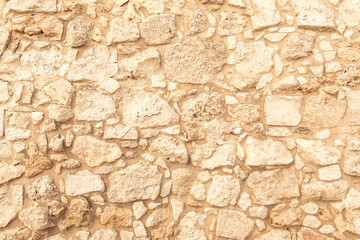 Wall Mural - Background of ancient brick wall. Texture of old amphitheater stone. Texture of an ancient brick wall made of sandstone. Archaeological excavations