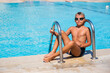 © LunaLu - Active lifestyle of Happy boy with goggles in the swimming pool Summer vacation